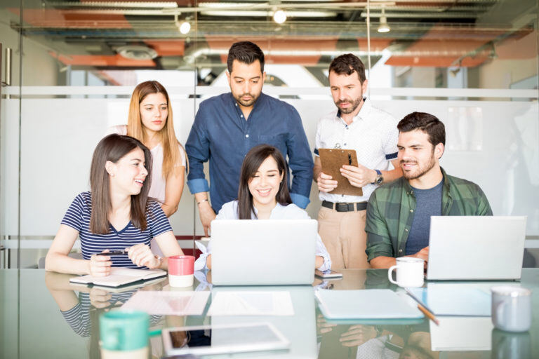 group-hispanic-businesspeople-casuals-around-laptop-computer-during-meeting-768x512