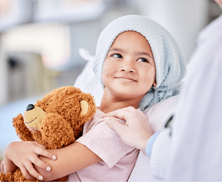 girl holding a teddy